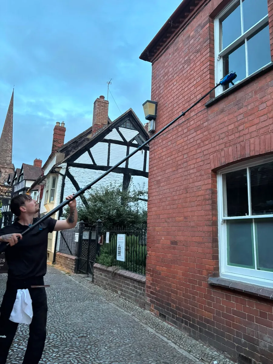 CleanScape window cleaner using a water-fed pole on a commercial property in Herefordshire
